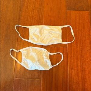 Two white cotton face masks